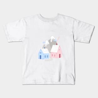 Cozy Winter Christmas Houses surrounded by mountains Kids T-Shirt